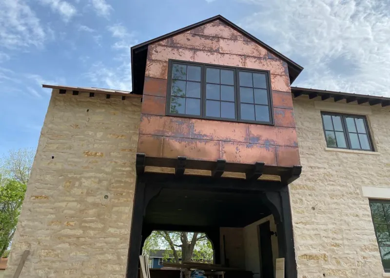 Copper metal panel facade on a stone building for Metal Roof Coating in Kahului