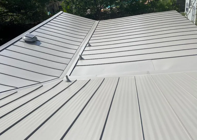 Solar attic fan installed on a metal roof for Roof Ventilation in Kahului